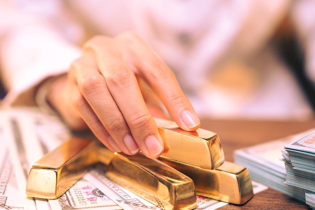 Shiny gold bar arrangement in a row Business Gold future and financial concept concept of world economics and currency exchange Money trade and safe haven marketplace