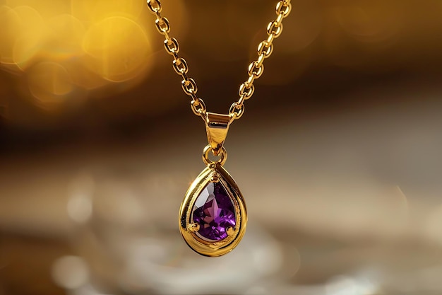 Shiny gold necklace with gemstone drop pendant