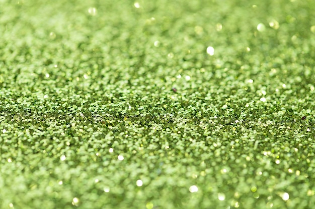 Shiny green glitter textured background