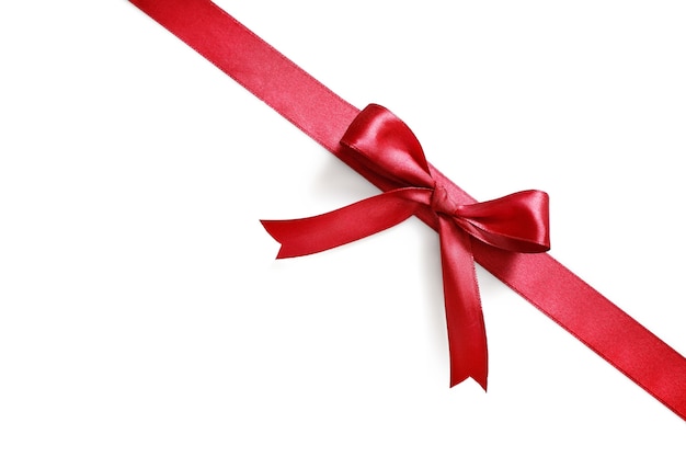 Shiny red satin ribbon and bow isolated 