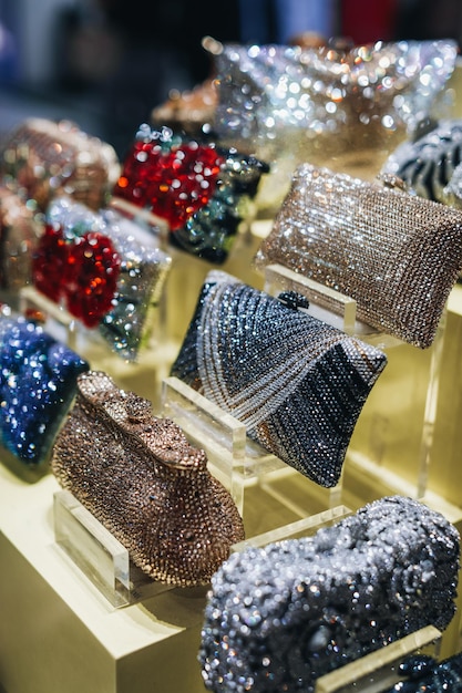 Shiny women's clutches with rhinestones on the store counter