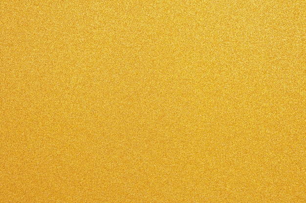 Shiny yellow surface gold glitter texture abstract background