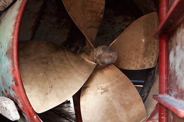 Photo ship's bronze propeller at the stern of the ship closeup