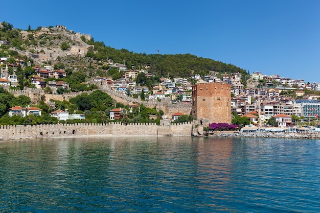 Shipyard and the ruins of a medieval fortress on the mountainside in Alanya, Turkey