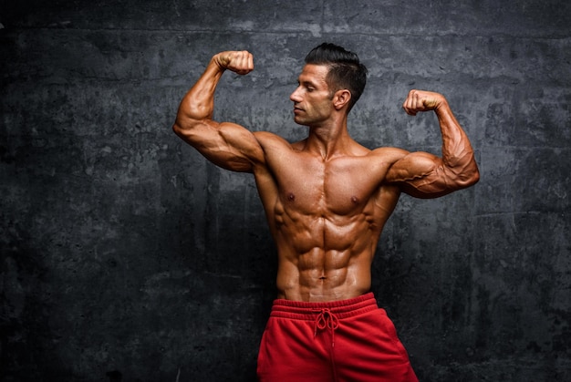 Shirtless muscular man in blue shorts