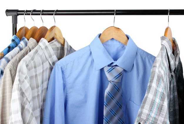 Shirts with ties on wooden hangers isolated on white