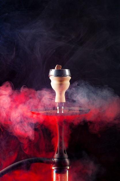 Shisha hookah with hot coals on black background close up