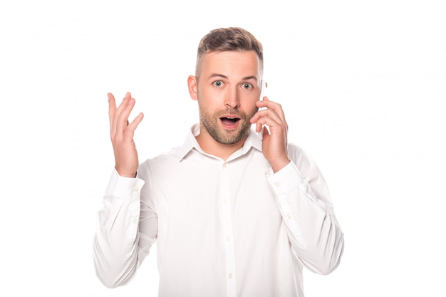 shocked businessman talking on smartphone isolated on white