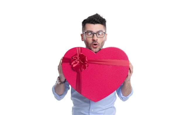 Shocked man with love valentine present in studio man with love valentine present