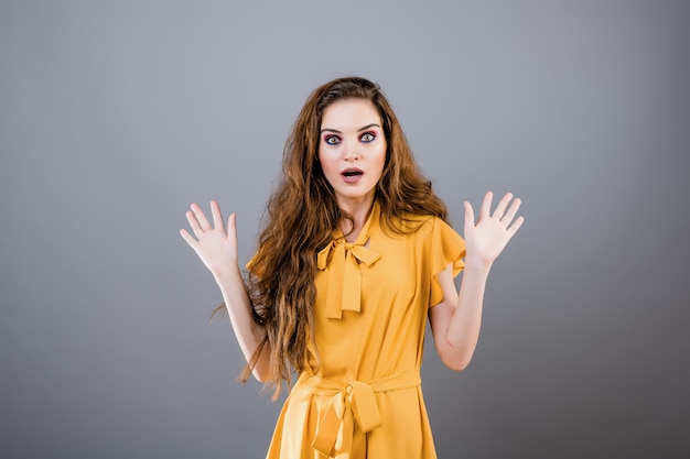 Shocked and surprised young woman isolated