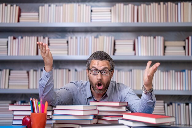 The shocked teacher at the classroom workplace Hispanic teacher share his knowledge and education Teacher leading lesson in the classroom teachers classroom at school back to school