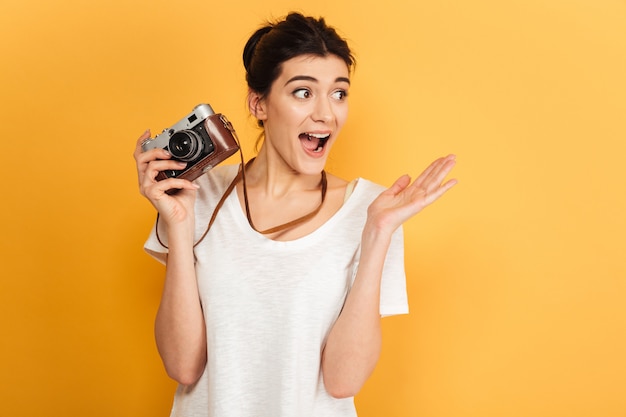 Shocked young pretty woman photographer