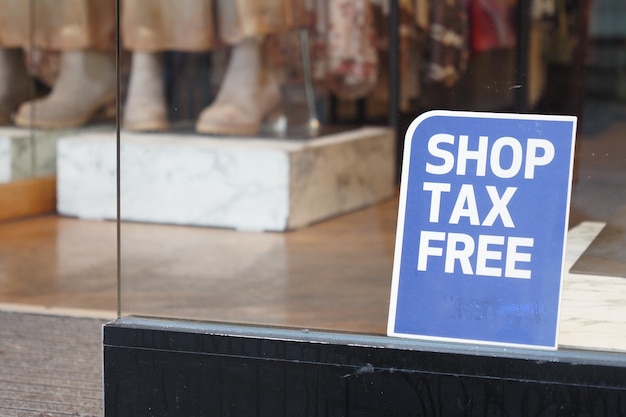 Shop tax free text duty free shop sign on shop window