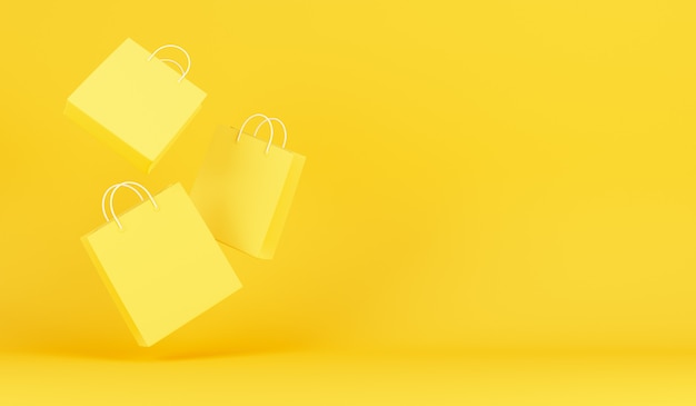 Shopping bags on yellow background