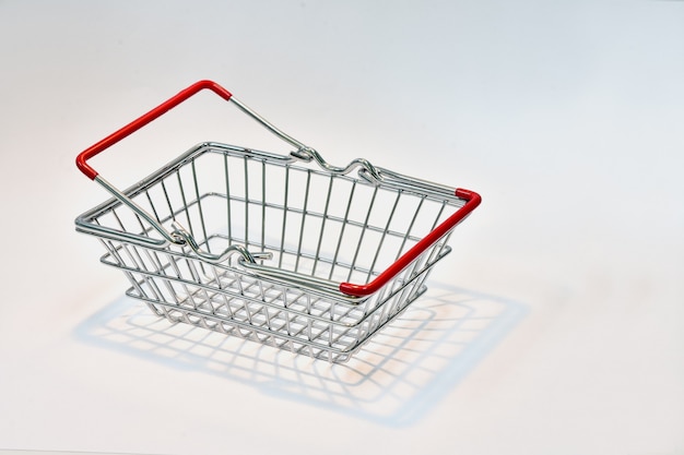 Shopping basket with red handle With dollar bills 