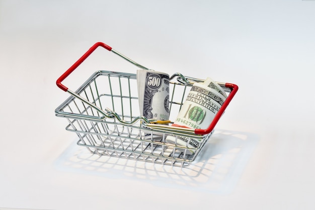 Shopping basket with red handle With dollar bills