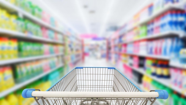 Shopping cart in blur supermarket background