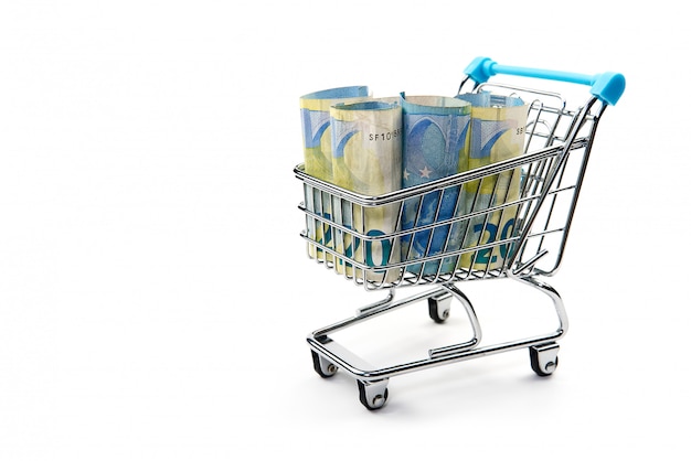 Shopping cart full of euro banknotes isolated on white.