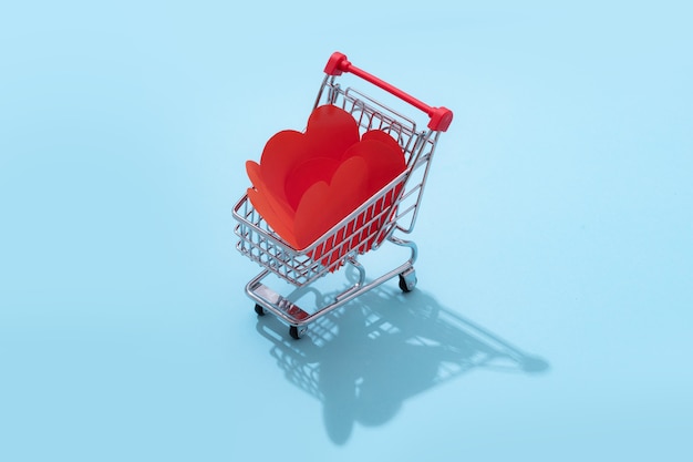 Shopping cart full of hearts for Valentines day isolated