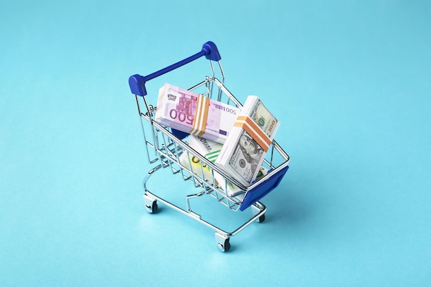 Shopping cart full of money Dollars and Euro sales and shopping exchange concept