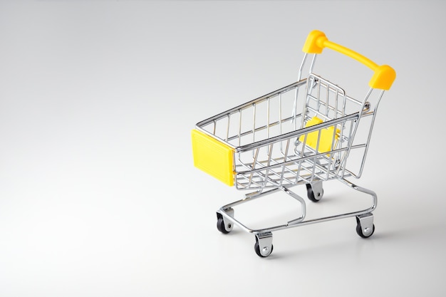 Shopping cart on grey