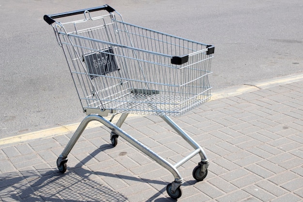 Shopping cart on the sidewalk close up