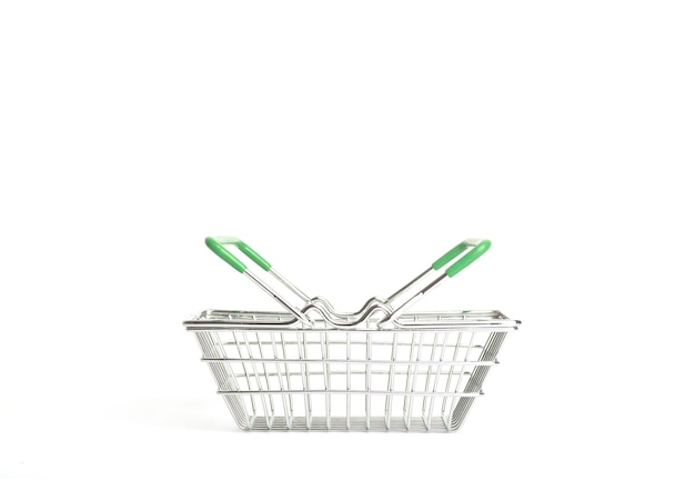 Shopping cart in a supermarket on an empty white background isolate Shopping groceries goods concept