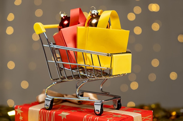 Shopping cart with packages for Christmas and New Year