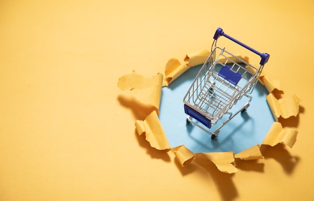 Photo shopping cart with a torn paper