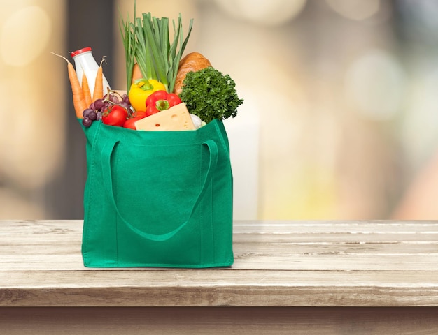 Shopping fabric bag with groceries on desk