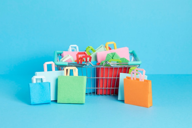 Shopping trolley full of paper bags shopping addiction concept