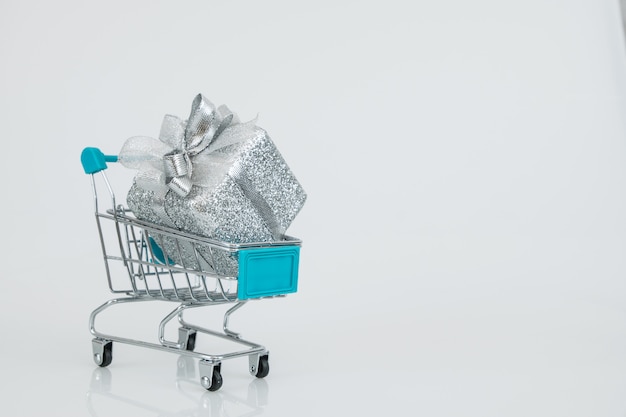 Shopping trolleys with the fully gift box fully fit on carts, online buying e-commerce.