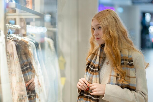 Shopping A young girl looks at shop window