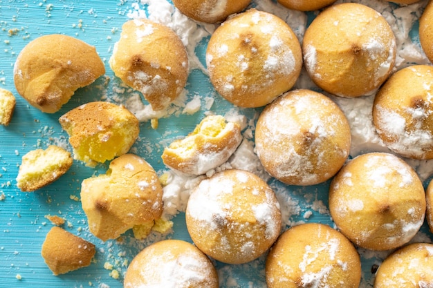 Shortbread filled with jam closeup of baked sweet cookies on a wooden background top view