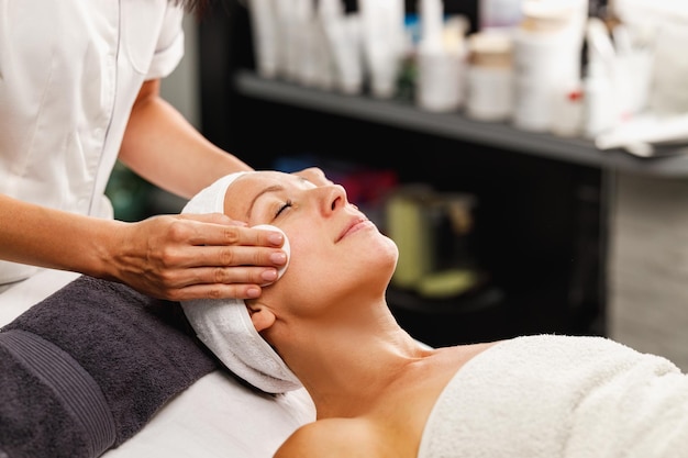 Shot of a beautiful mature woman on a facial treatment at the beauty salon.