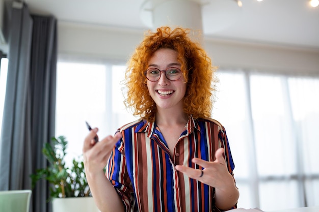 Shot of a businesswoman on a video call while sitting at her deskCropped shot of an attractive young woman using her laptop to make a video call at home