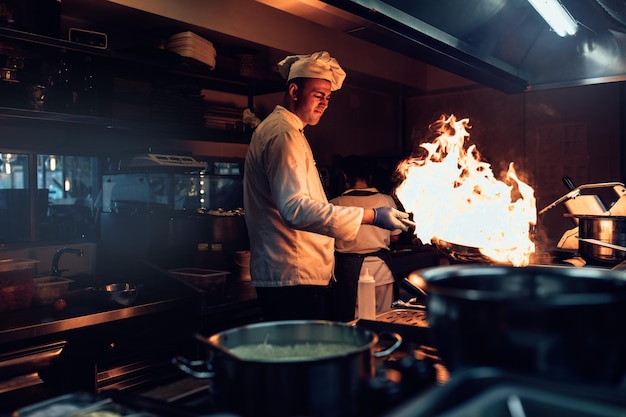 Shot of a chef cooking in a professional kitchen