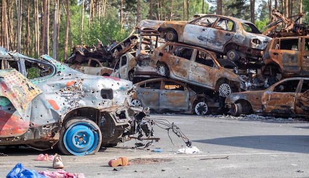 Shot damaged cars during the war in Ukraine The civilian car was damaged Shrapnel and bullet holes in the car body Car riddled with bullets Bullet holes and shell fragments