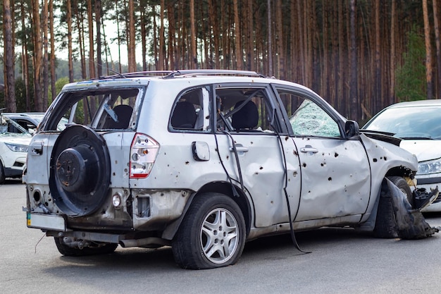 Shot damaged cars during the war in Ukraine The vehicle of civilians affected by the hands