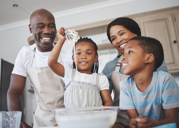 Shot of a family baking together in the kitchen