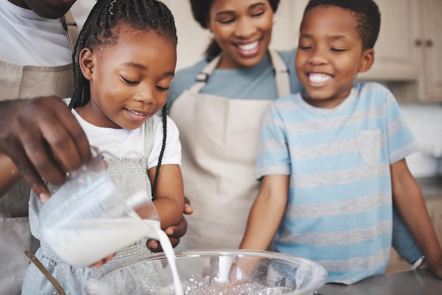 Shot of a family baking together in the kitchen