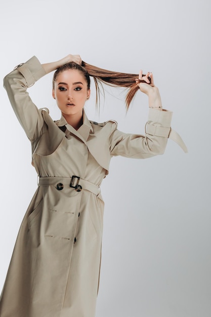 shot of fashionable woman in trench coat