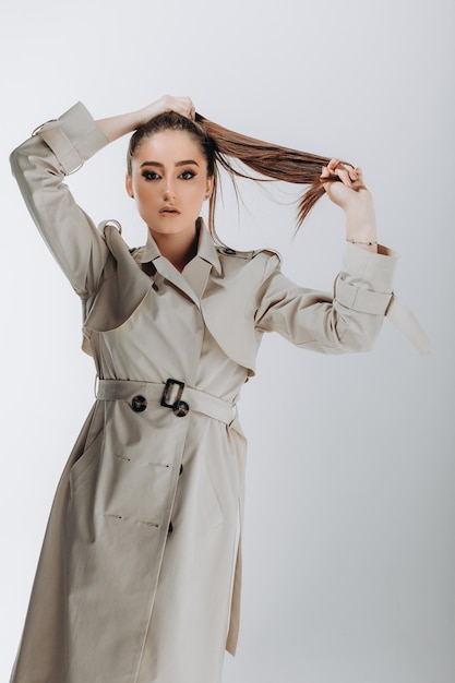 shot of fashionable woman in trench coat