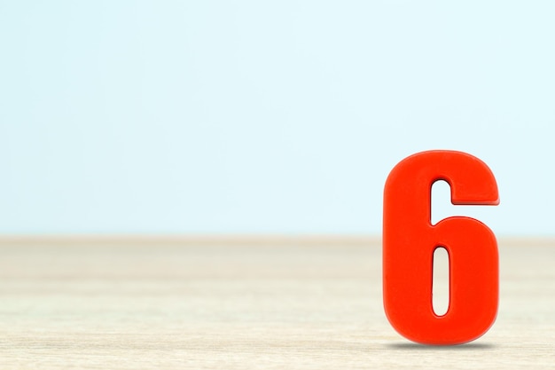 Photo shot of a number six made of red plastic