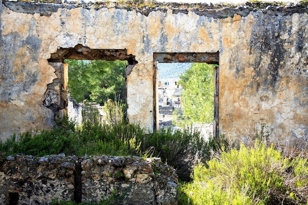 Shot of a ruined window on Ghost town Kayakoy Ghost town Kayakoy Turkey