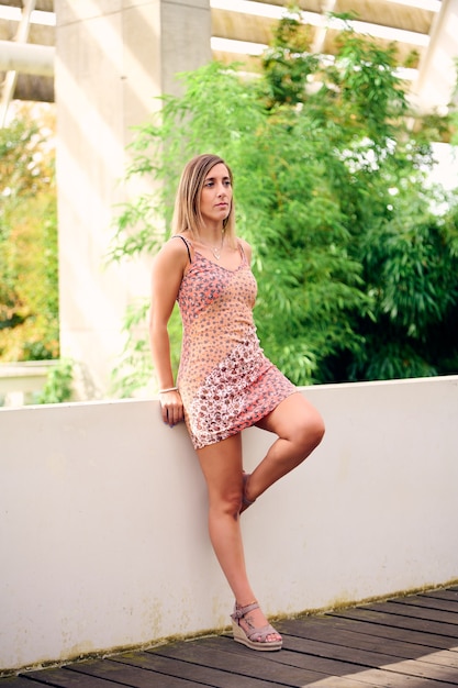 shot of a Spanish female on green leaves background