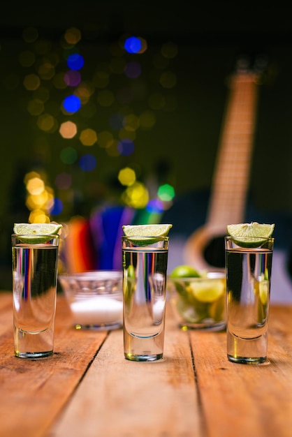 Shot of tequila on a wooden table