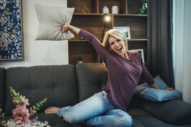 Photo shot of a young attractive woman feeling crazy and having fun on a free day at home.