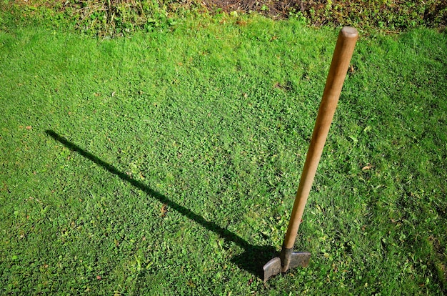 Shovel put in countryside ground backdrop