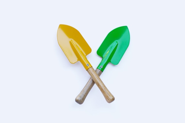 Shovels for gardening on white surface